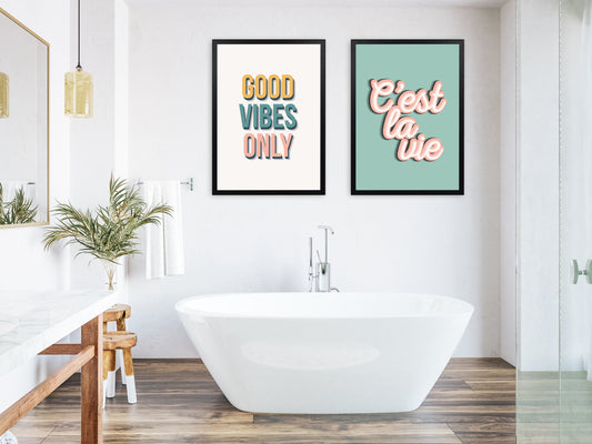 A collection of bathroom wall art prints in a bathroom setting with bath