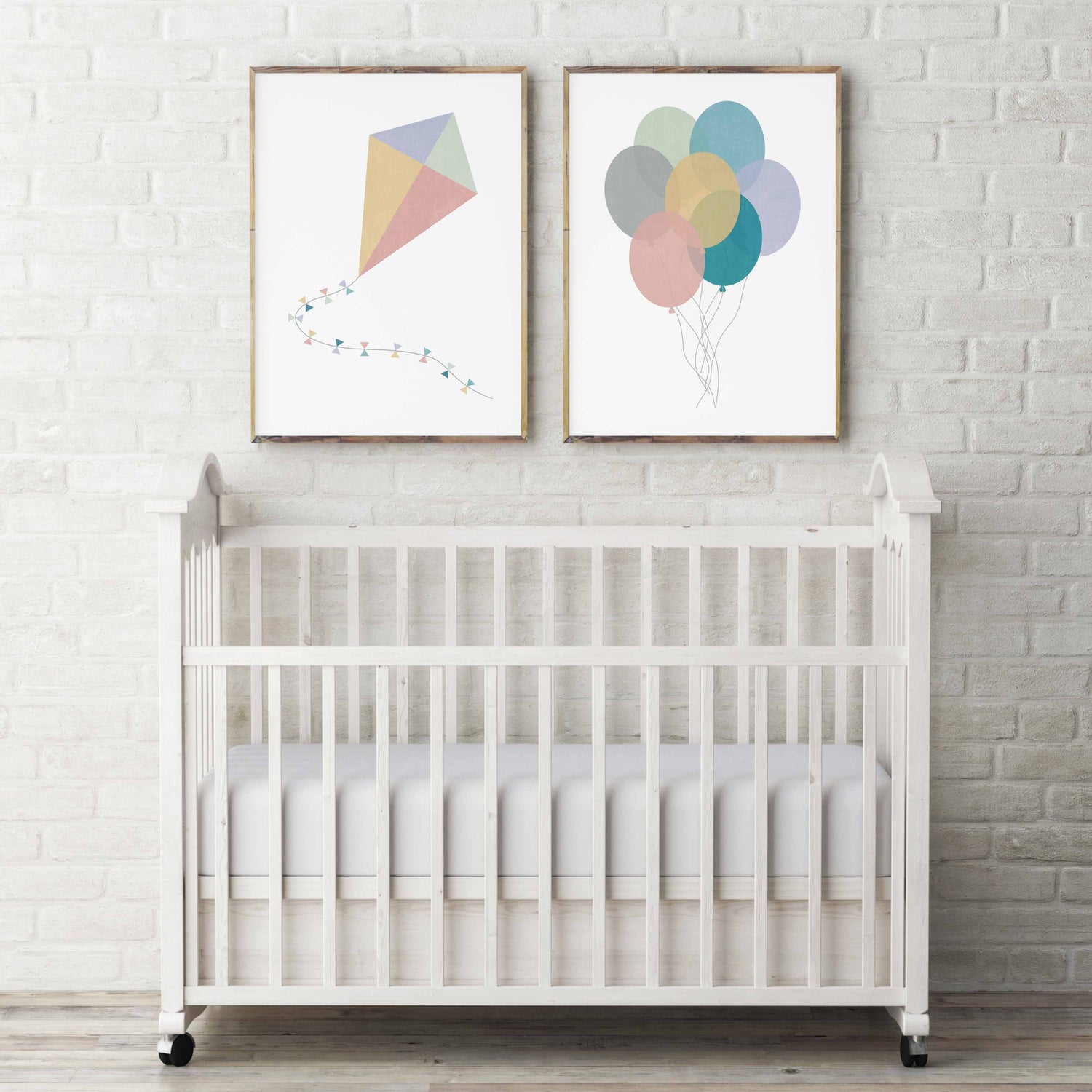 A set of two stylish nursery prints in pastel pinks, blues, yellows and greens. The prints are of a kite and some balloons in a modern nursery setting
