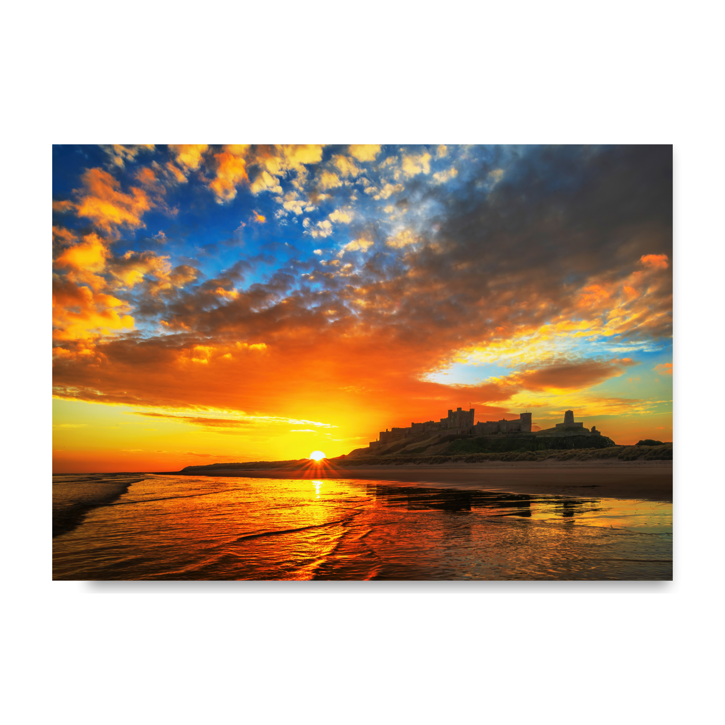 A Beautiful Sunrise at Bamburgh Castle by Steven Robinson